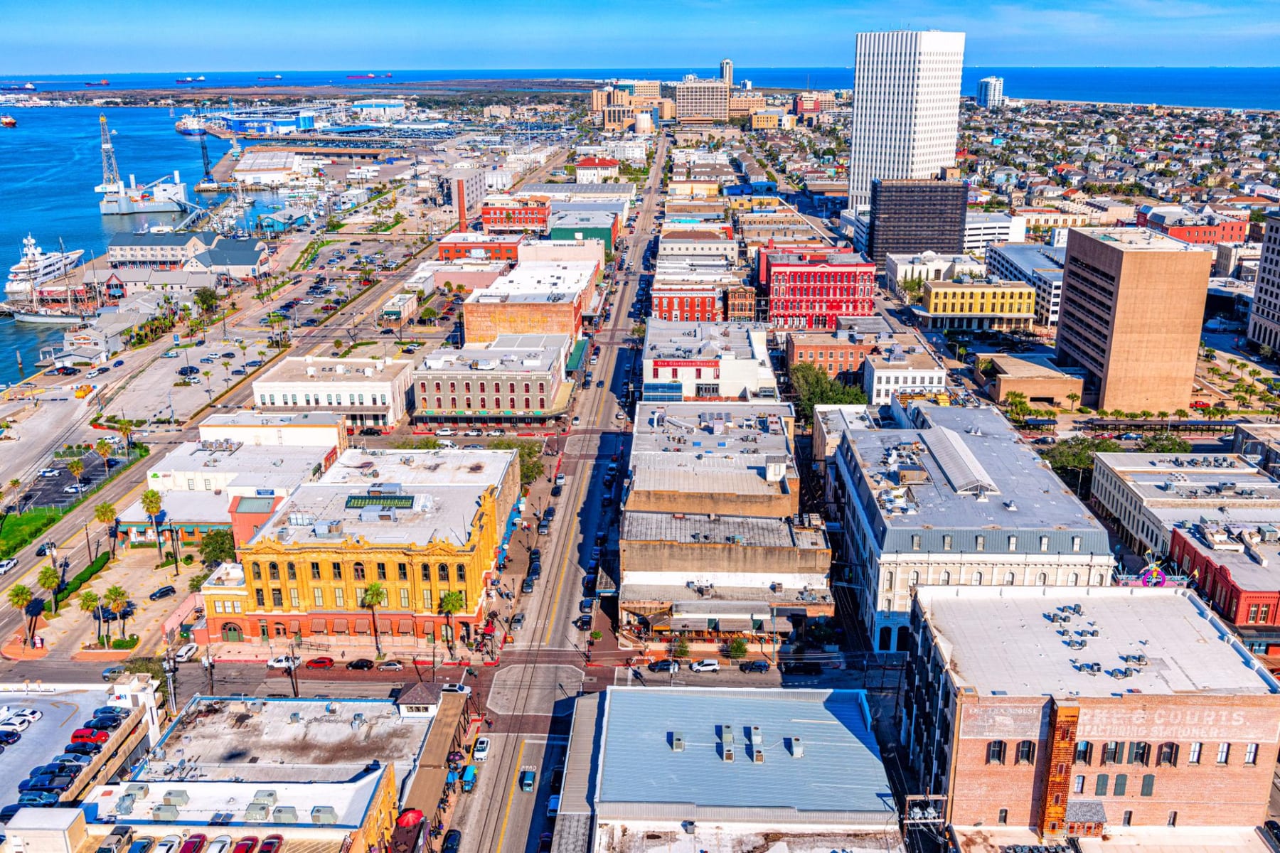 Aerial view of downtown Galveston's historic Strand district and harbor
