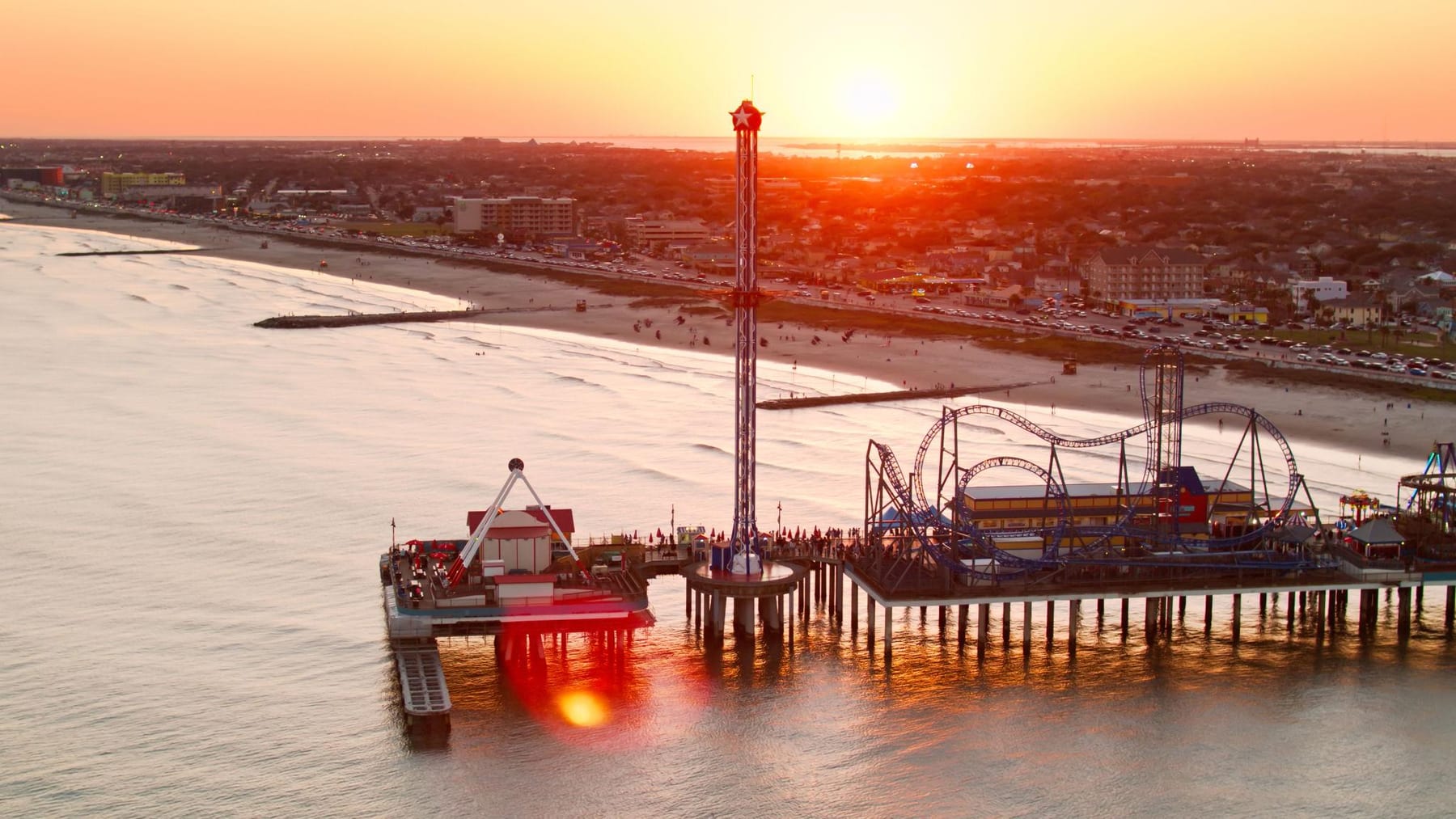 Galveston's Pleasure Pier at sunset over the Gulf of Mexico