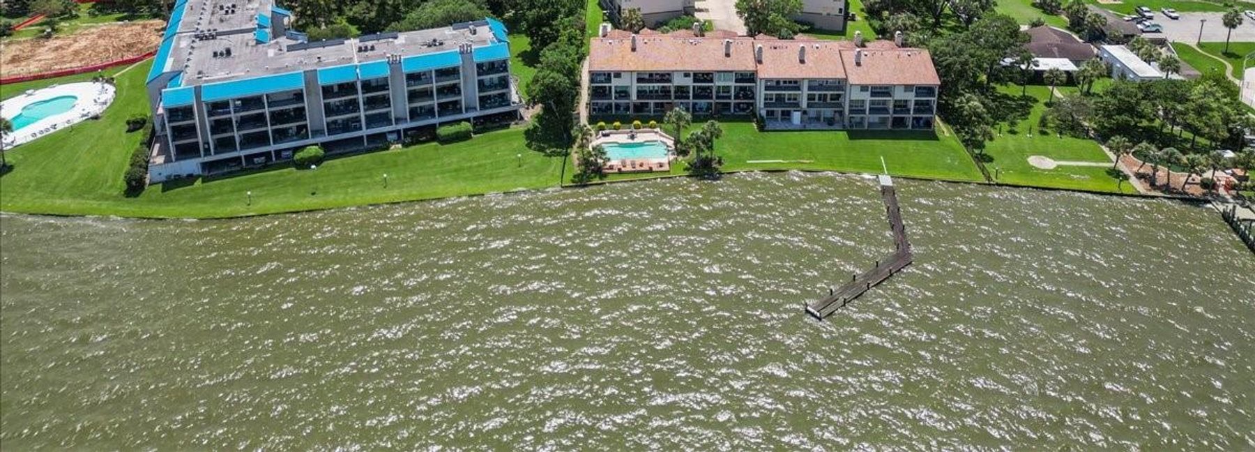 Aerial view of a waterfront marina community on Galveston Bay