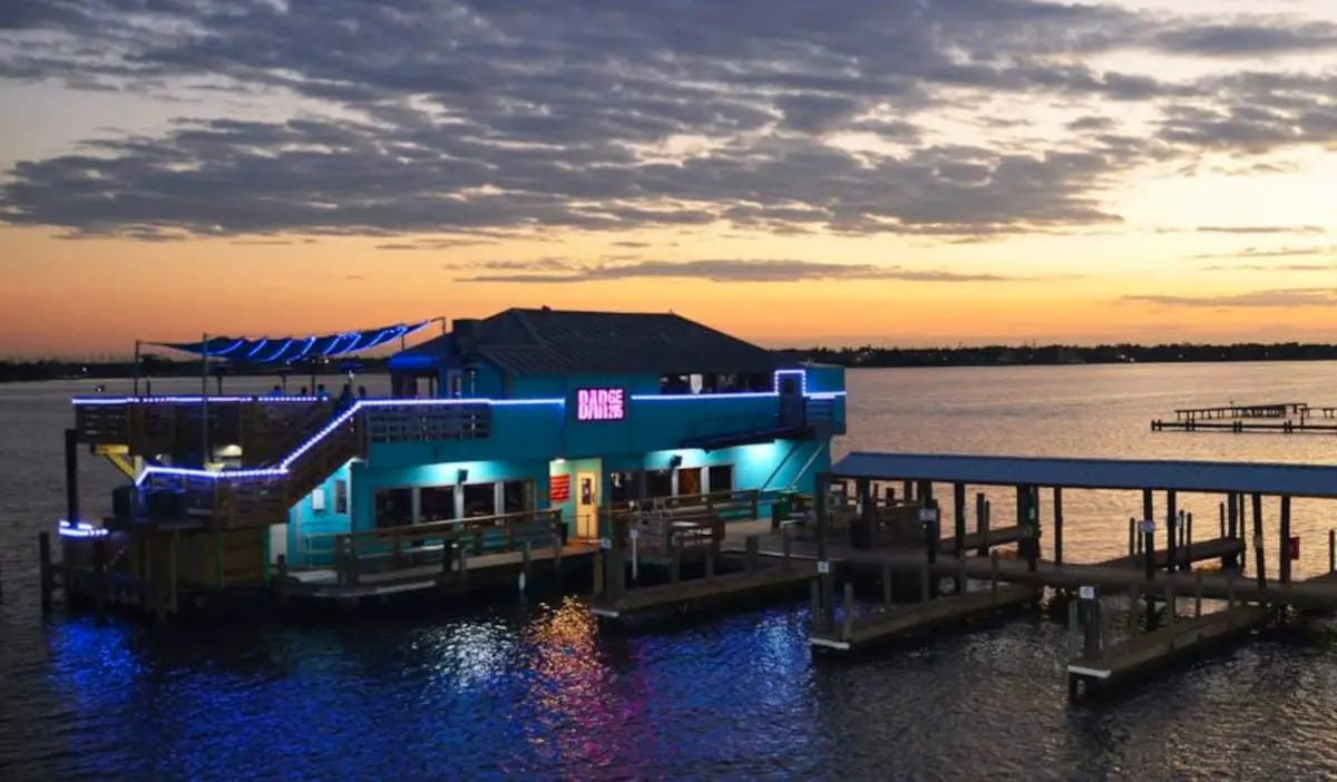 A waterfront restaurant on the water in Seabrook at sunset