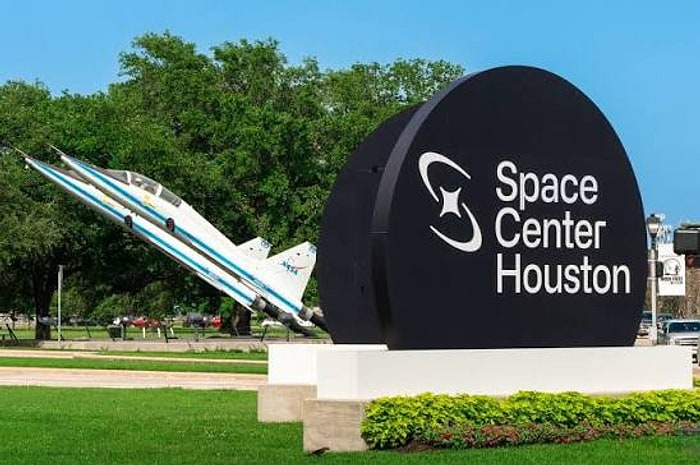 The Space Center Houston entrance sign, with a NASA jet aircraft on display